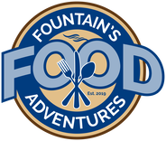 Mountain’s Food Adventures logo with crossed utensils, blue and gold circular design