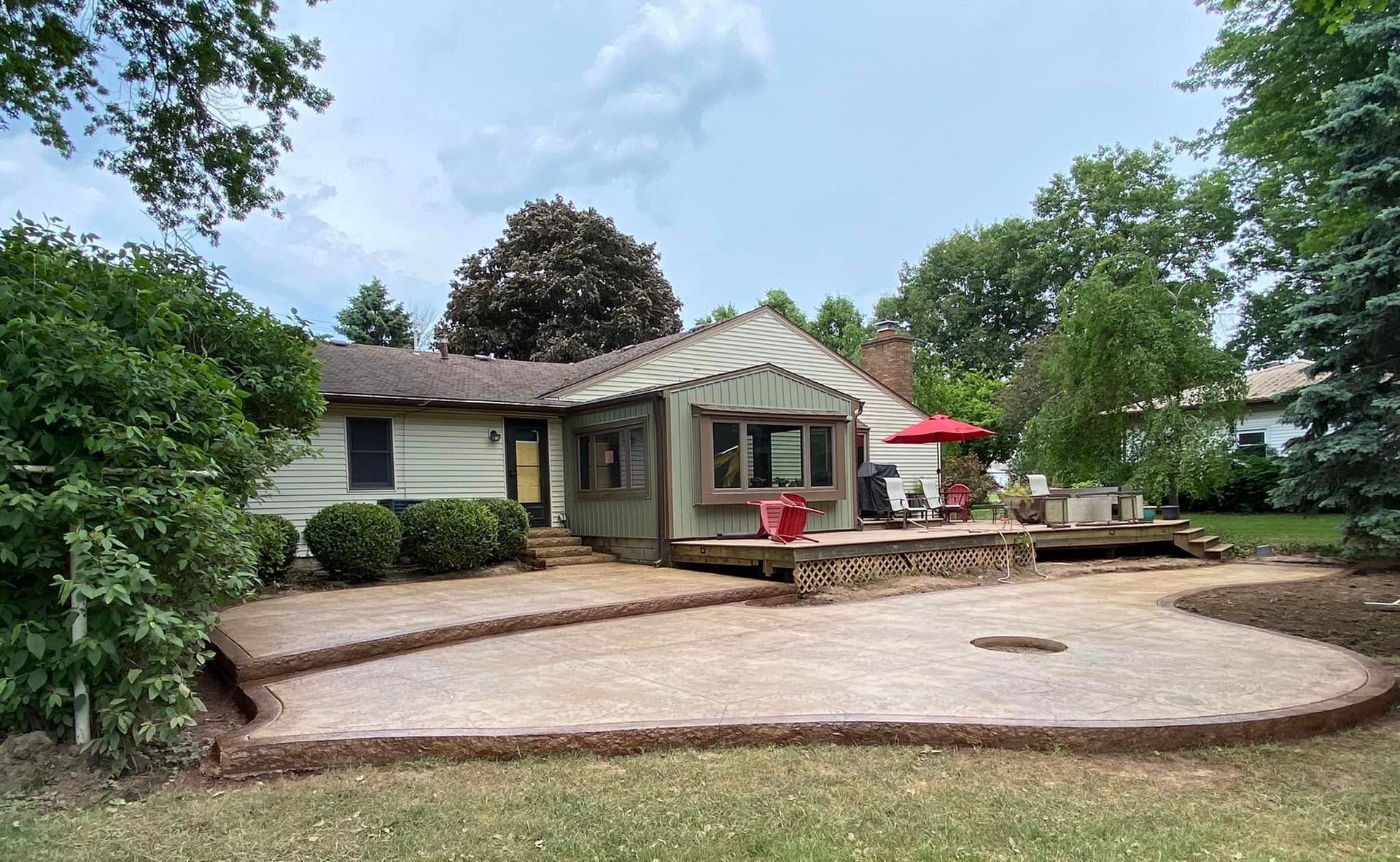 A house with a large patio in front of it