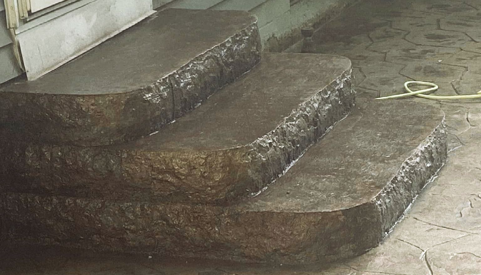 A set of stone steps leading up to a house.
