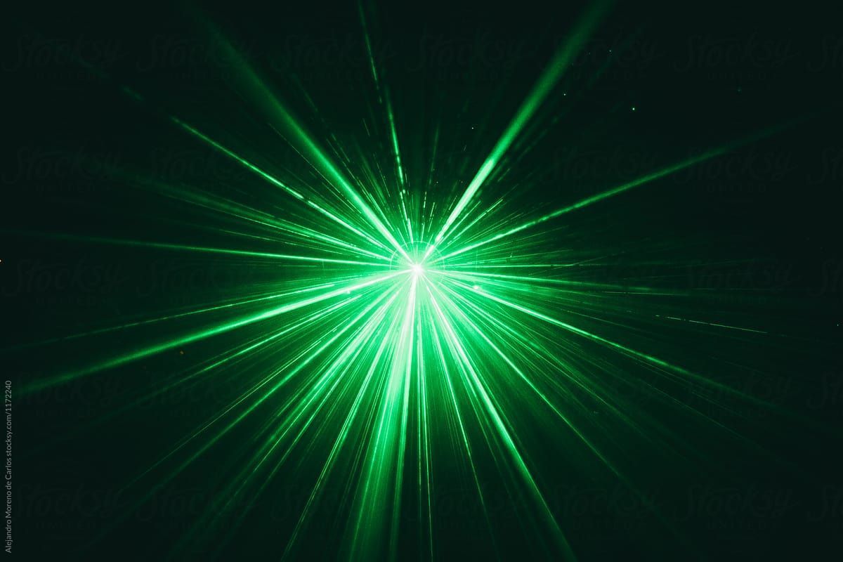 Bright green laser beams radiating outwards from a central point against a black background.