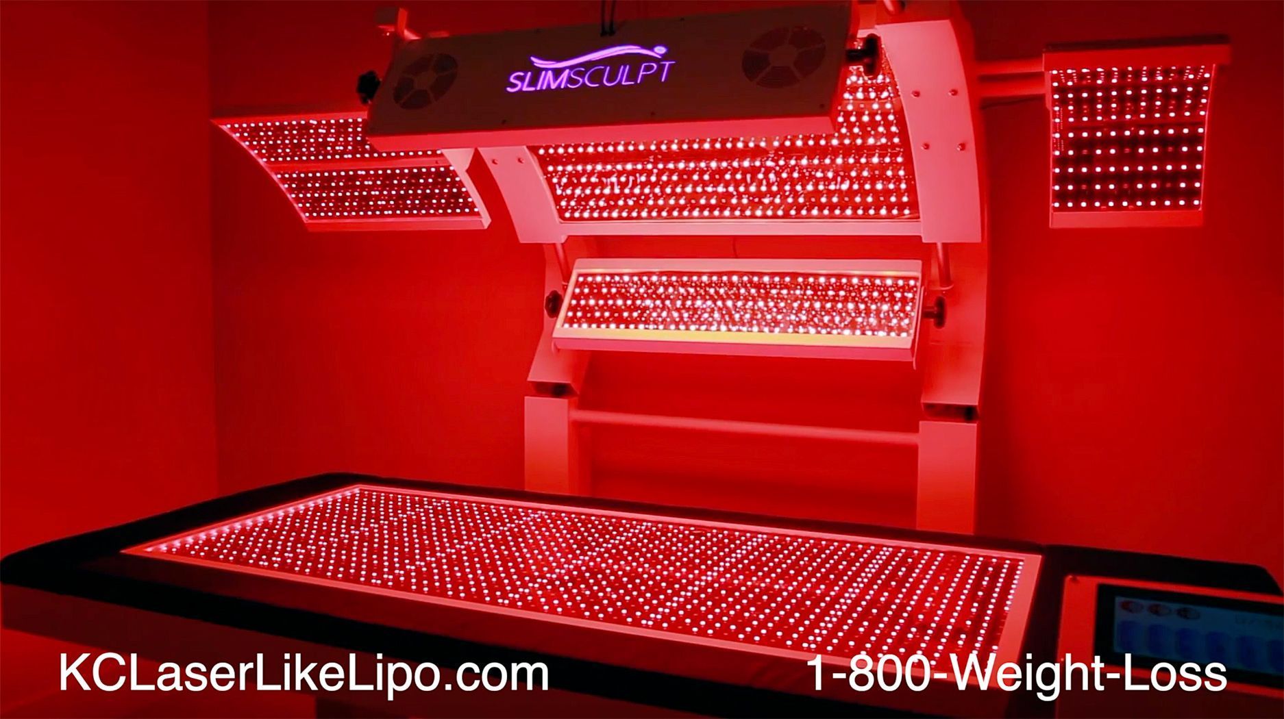 Red light therapy machine with a bed, panels, and lights.