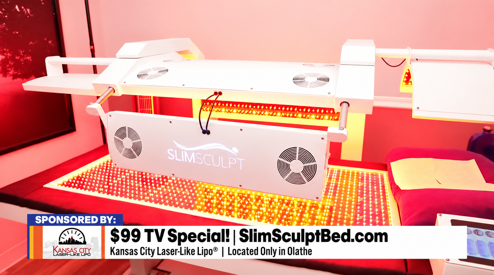 White industrial machine on a red-lit surface with a banner ad reading “$99 TV Special | SlimSculptBed.com”