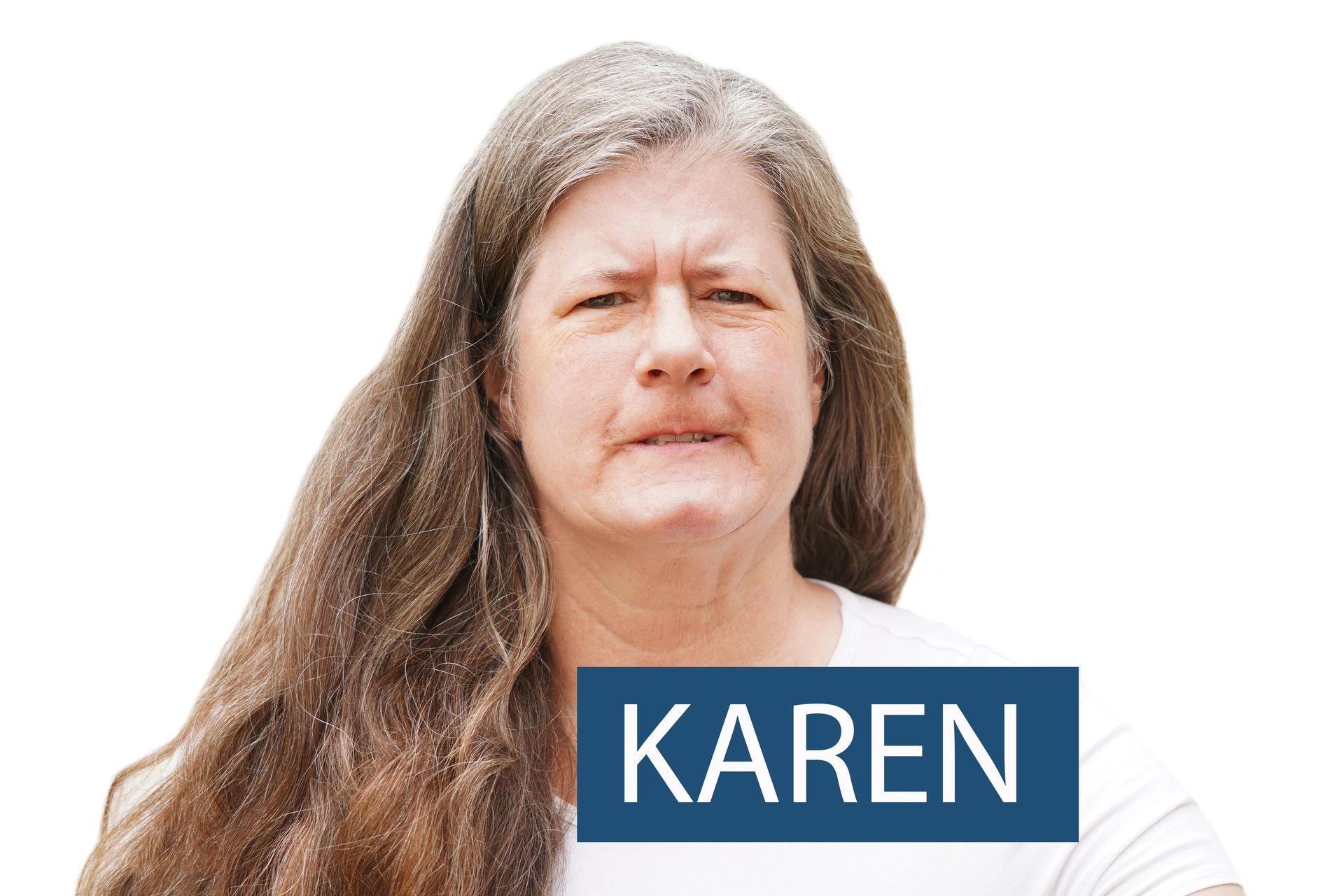 Woman with long, gray hair and a stern expression; 