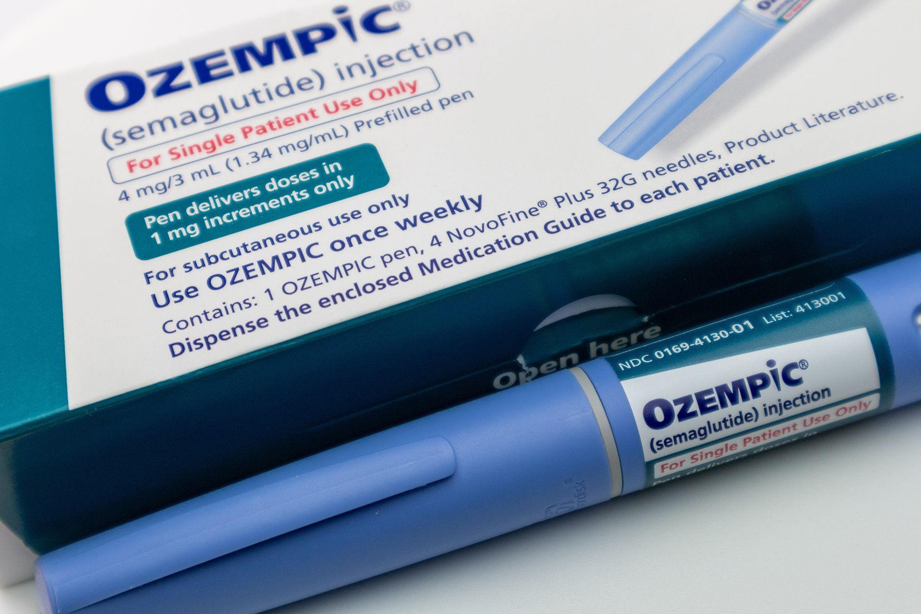 Ozempic injection pen and box, blue and white packaging. 