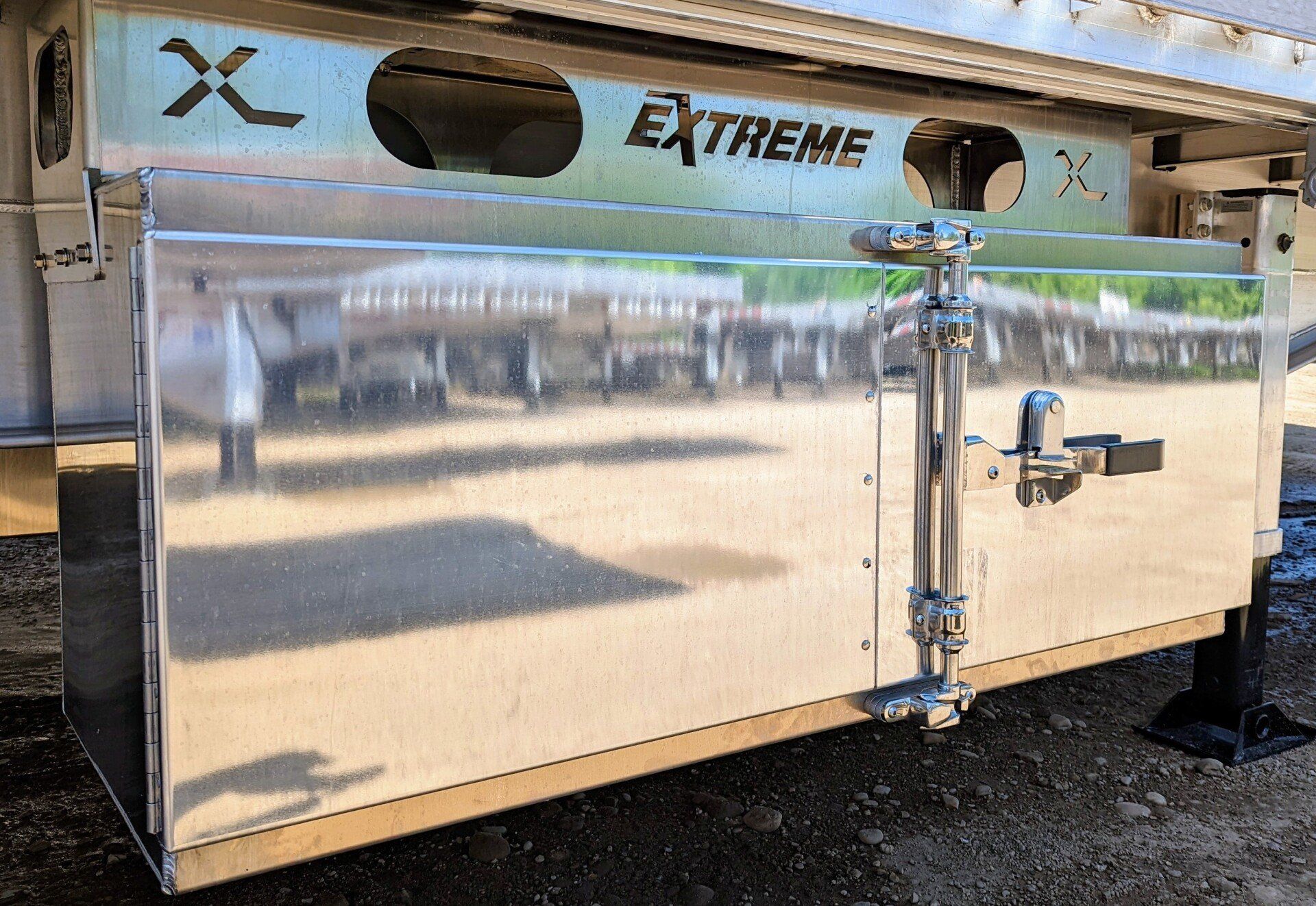 Aluminum storage compartment with the word 