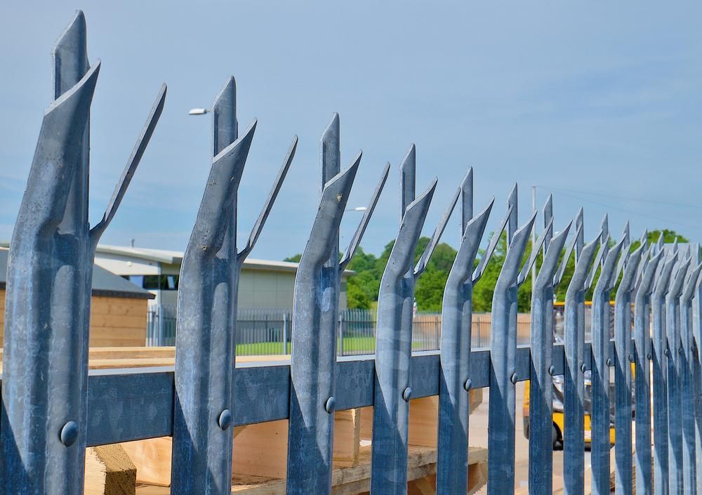 A Fence With A Lot Of Spikes On It — Rabbo's Fencing Services In Pinelands, NT