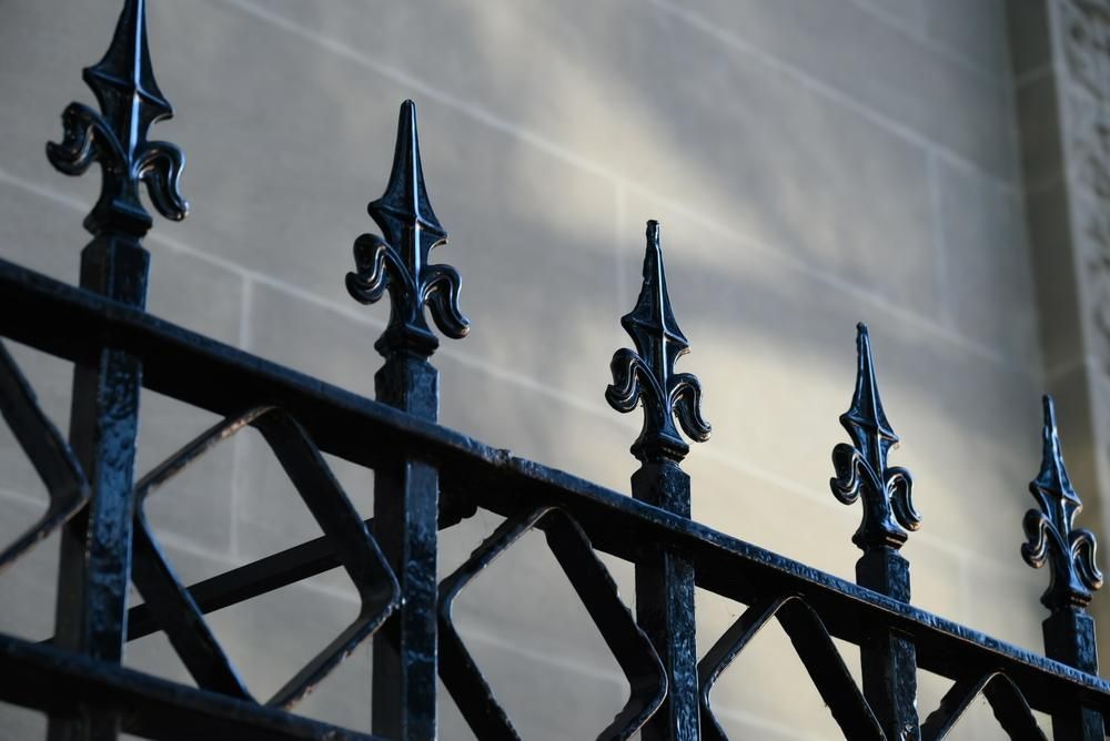 A Close Up Of A Wrought Iron Fence With Spikes On It — Rabbo's Fencing Services In Howard Springs, NT