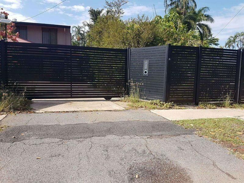 A Black Fence With A Mailbox In The Middle Of It — Rabbo's Fencing Services In Pinelands, NT