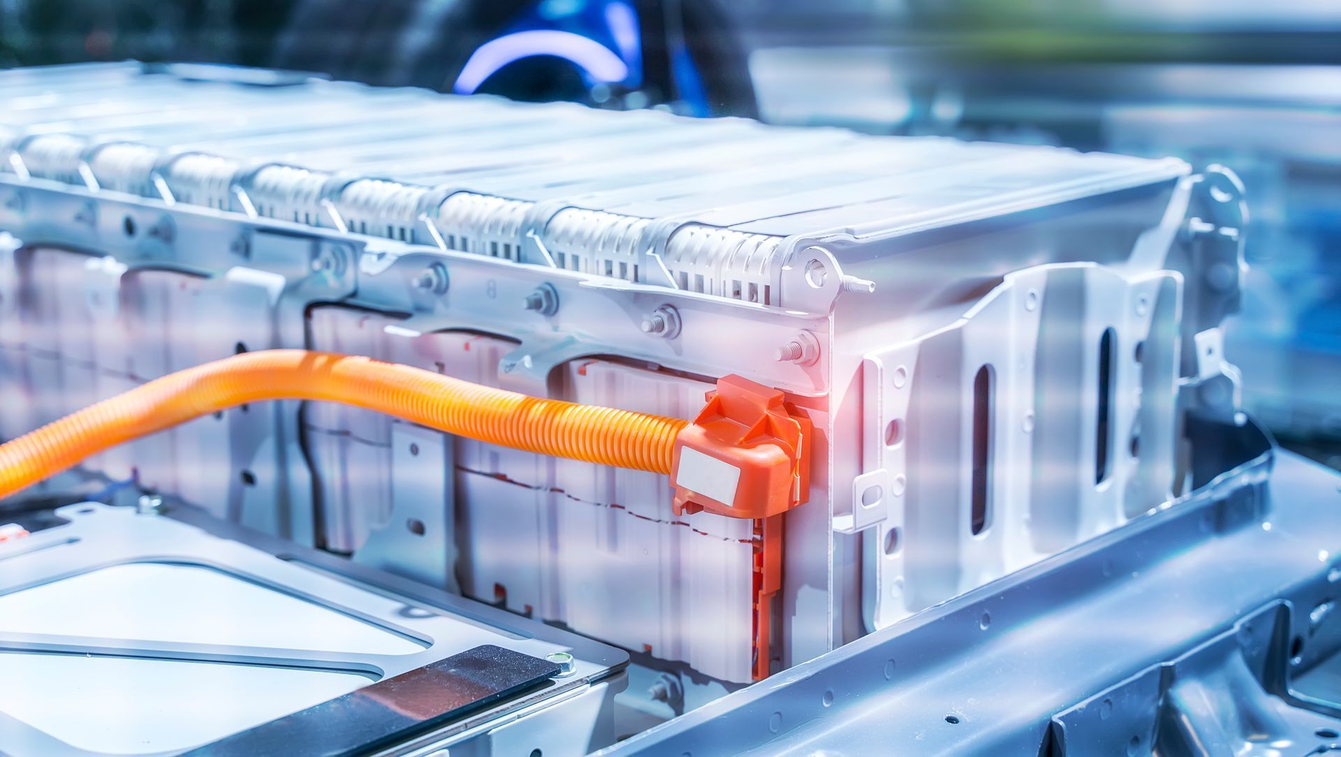 Technician testing a hybrid car battery with diagnostic equipment at ABC Auto Repair in Burien, WA