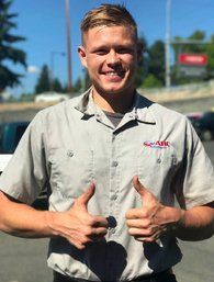 ABC Auto Repair service writer in Burien assisting customers at the front desk