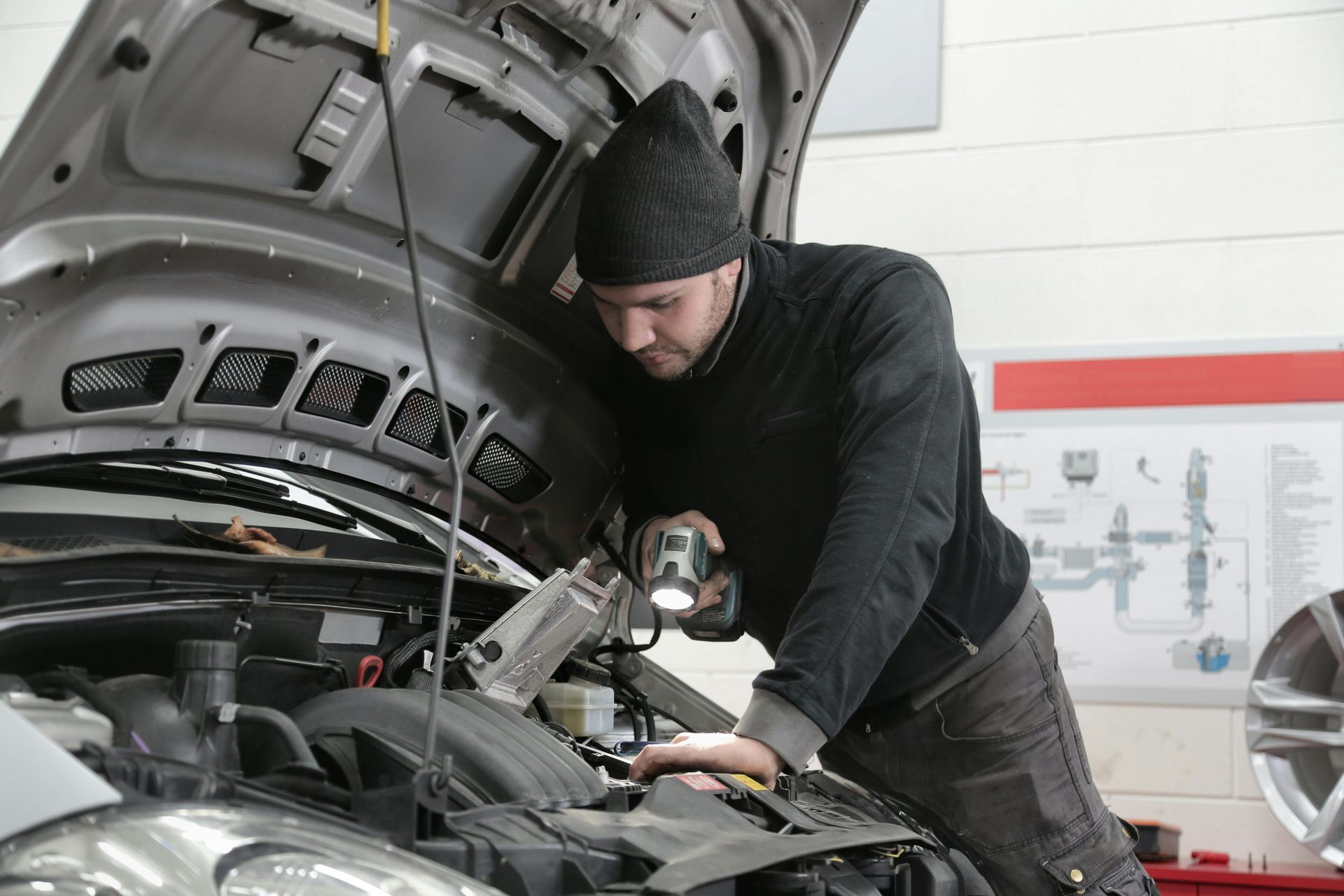 ABC Auto Repair mechanic in Burien diagnosing engine noise during inspection