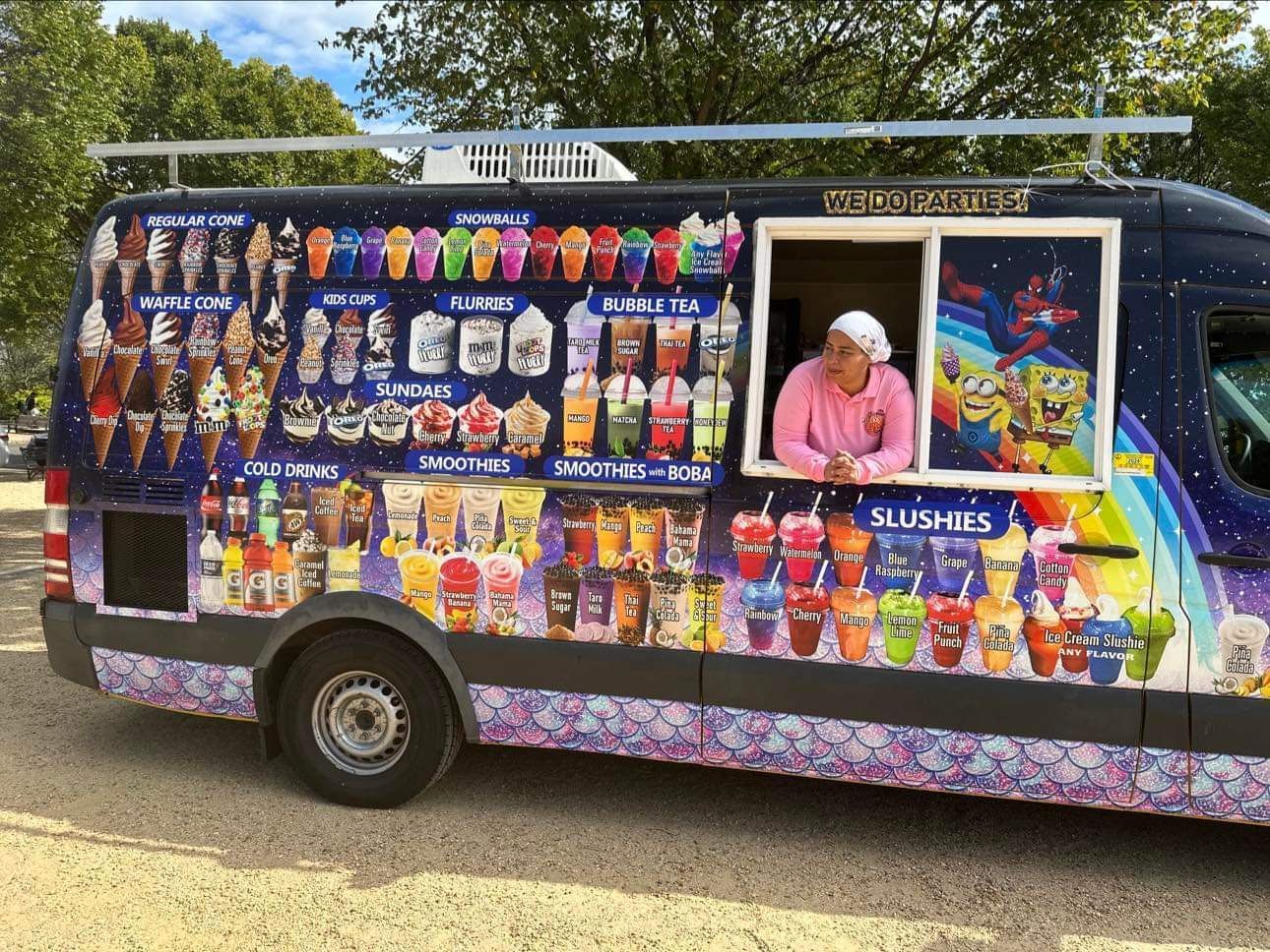 A spongebob ice cream truck is parked in a parking lot