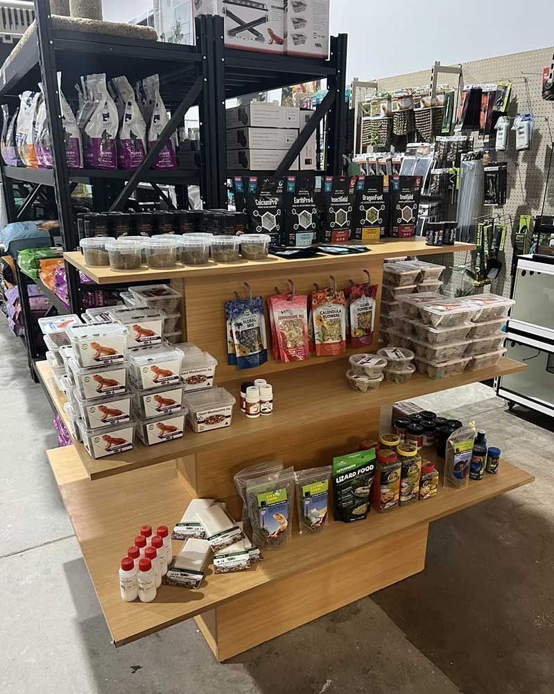 Dog Food and Treats Displayed on Wooden Shelves in a Store — Jonath’s Animal Kingdom in Maitland, NSW