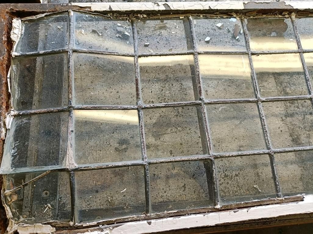 Badly damaged and distorted lead light panel awaiting restoration