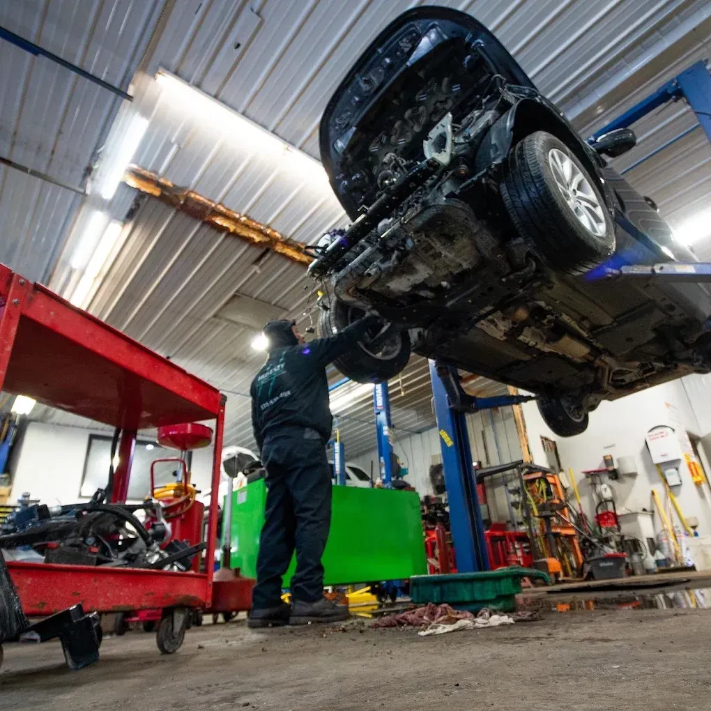 Car on Jack | Honesty Automotive Repairs