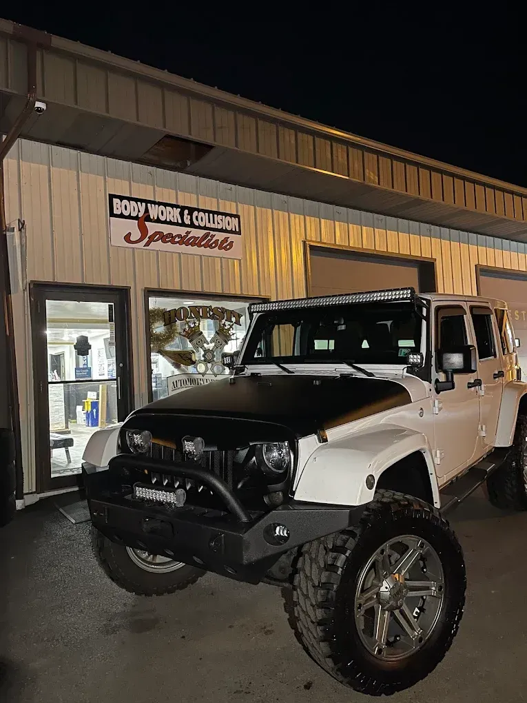 White Jeep Parked In Front of Auto Shop | Honesty Automotive Repairs