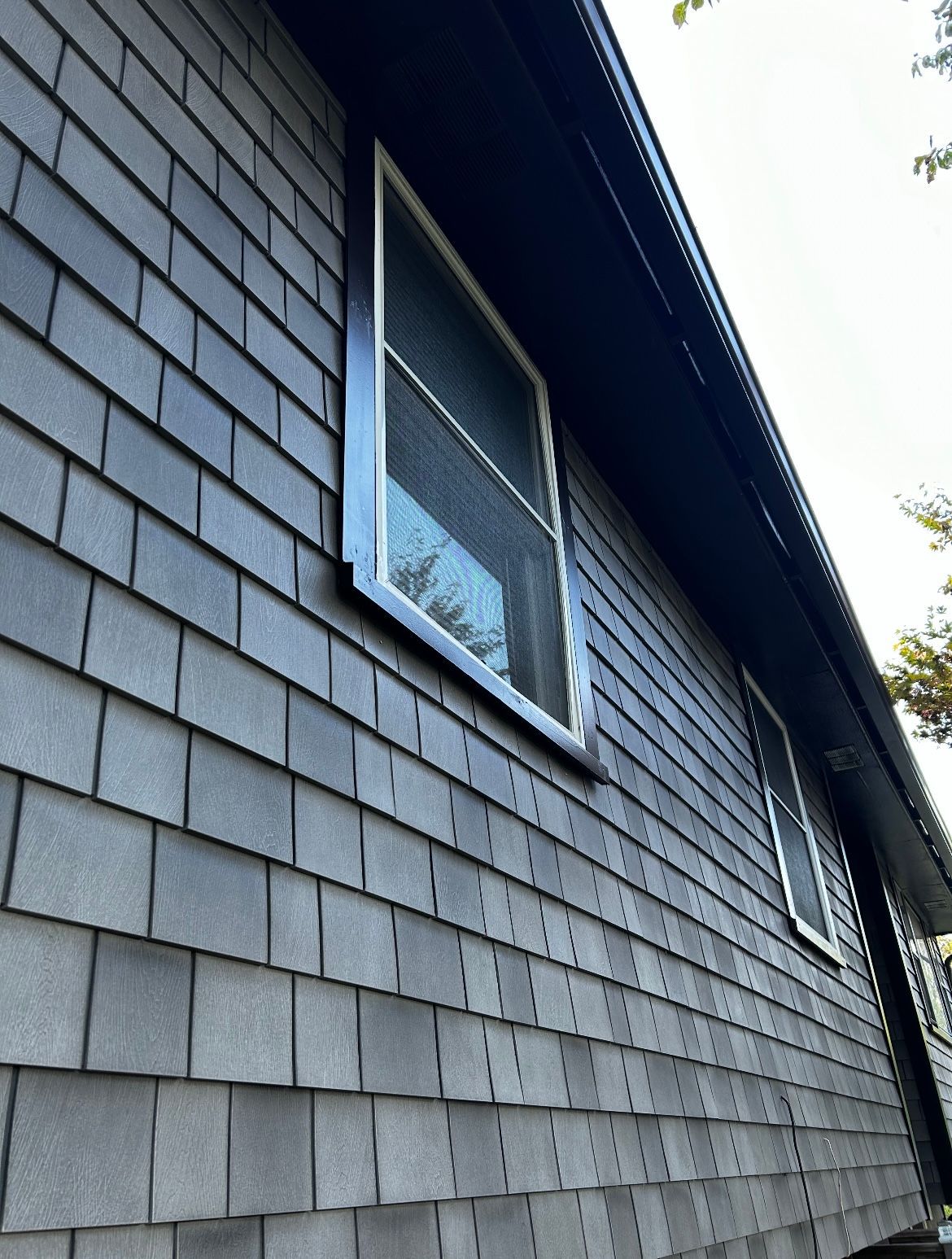 A brick building with a window on the side of it