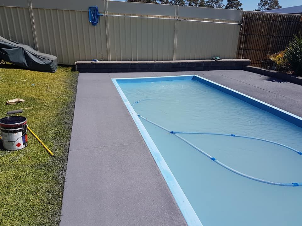 A Large Swimming Pool With A Fence Around It — Turn It Crete in St Georges Basin, NSW