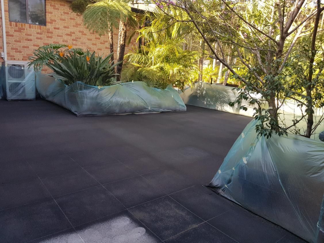 A Patio With A Lot Of Plastic Bags On It — Turn It Crete in St Georges Basin, NSW