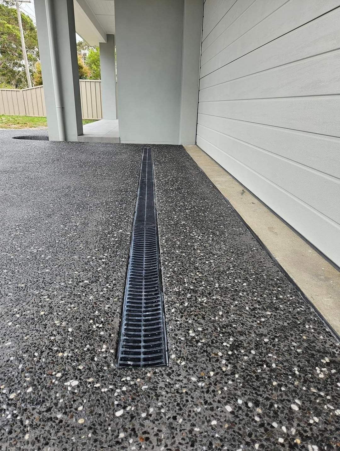 A concrete driveway is being built in front of a house — Turn It Crete in St Georges Basin, NSW