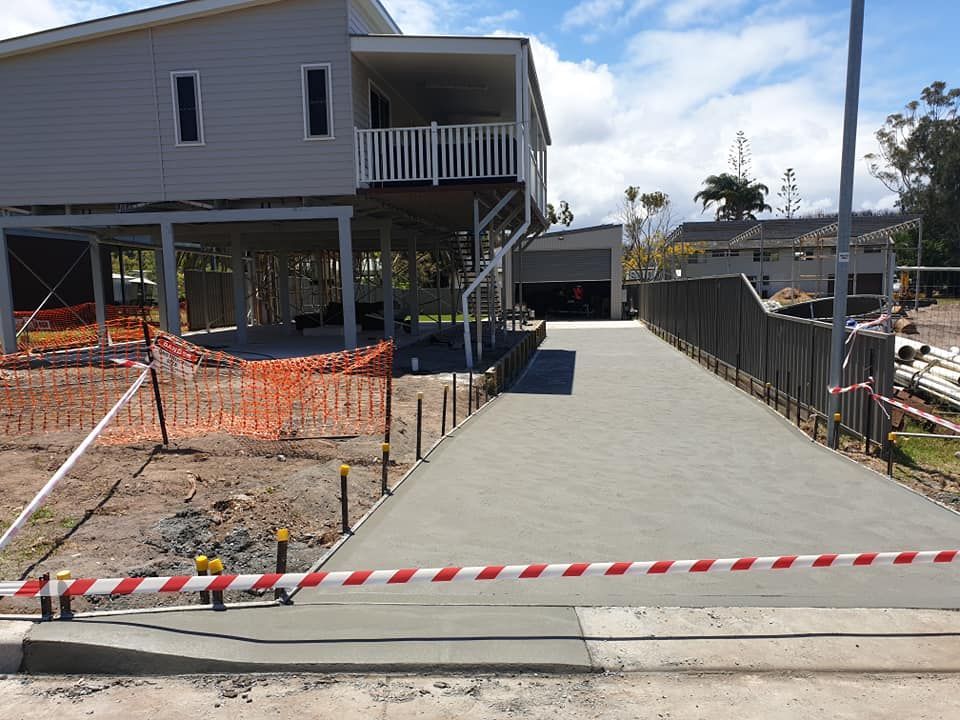 A Concrete Driveway Is Being Built in Front of A House — Turn It Crete in St Georges Basin, NSW