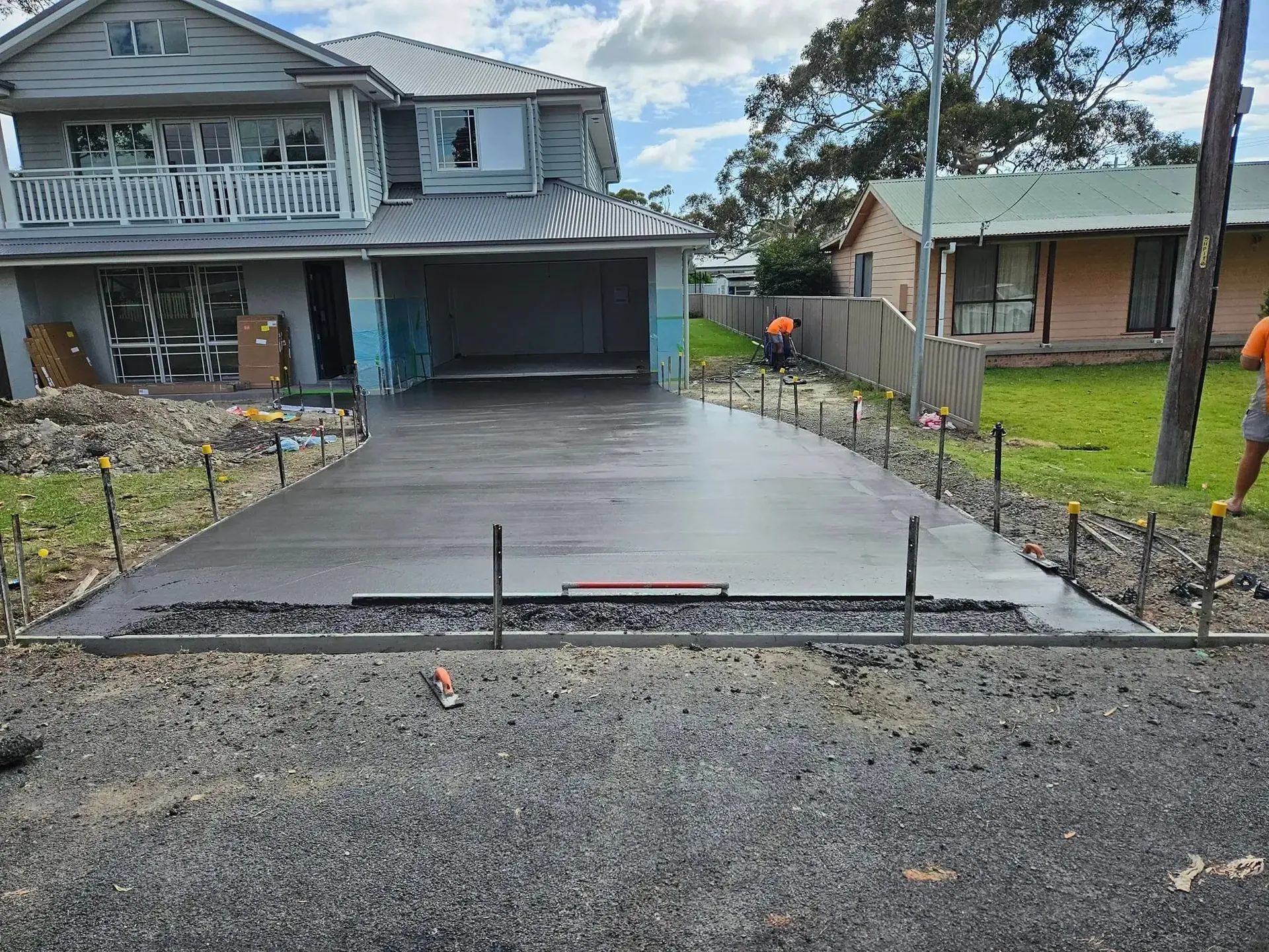 A Concrete Driveway Is Being Built in Front of A House — Turn It Crete in Berry, NSW