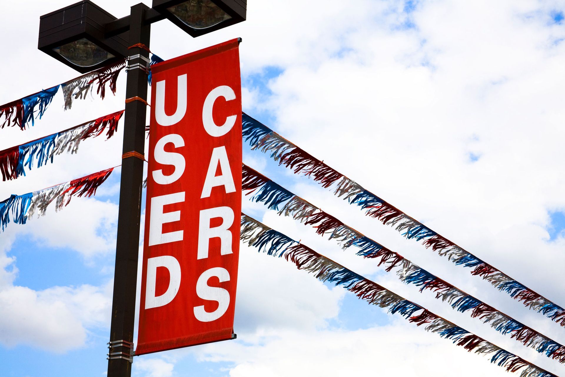 A red banner on a pole that says uc saver ds