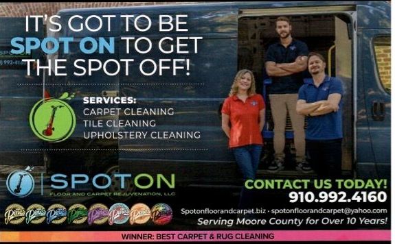 A group of people standing in front of a van that says spoton