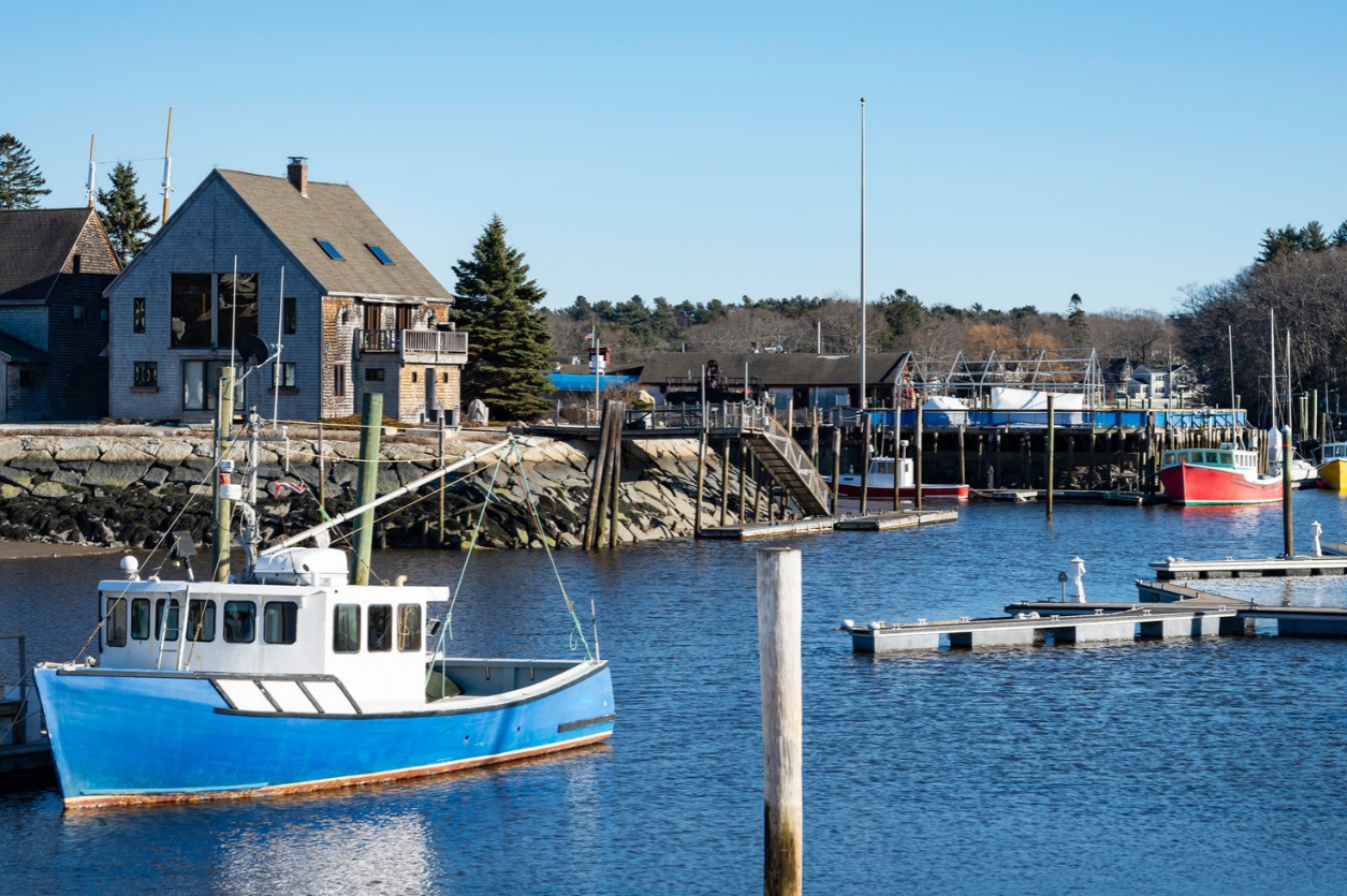 Kennebunkport harbor with blue boat Kennebunkport Maine.