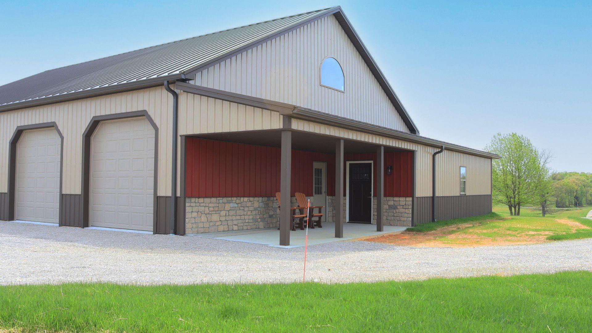 Porch area with red metal and 3' stone wainscot accent.