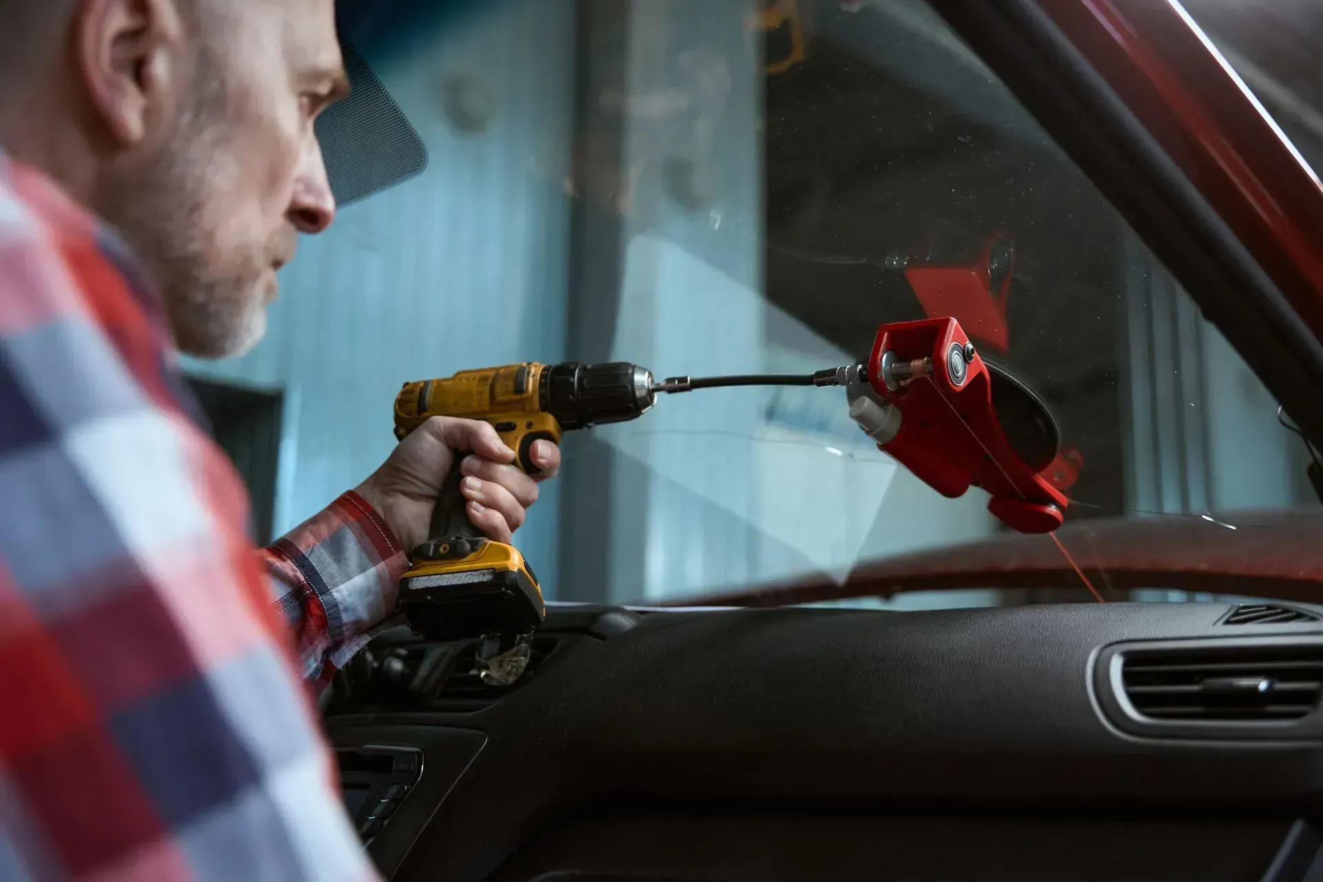 Power Drill To Operate a Red Glass Repair Tool