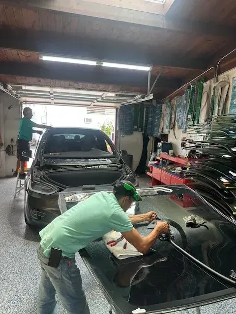 Auto Technicians Prepare a Replacement Windshield