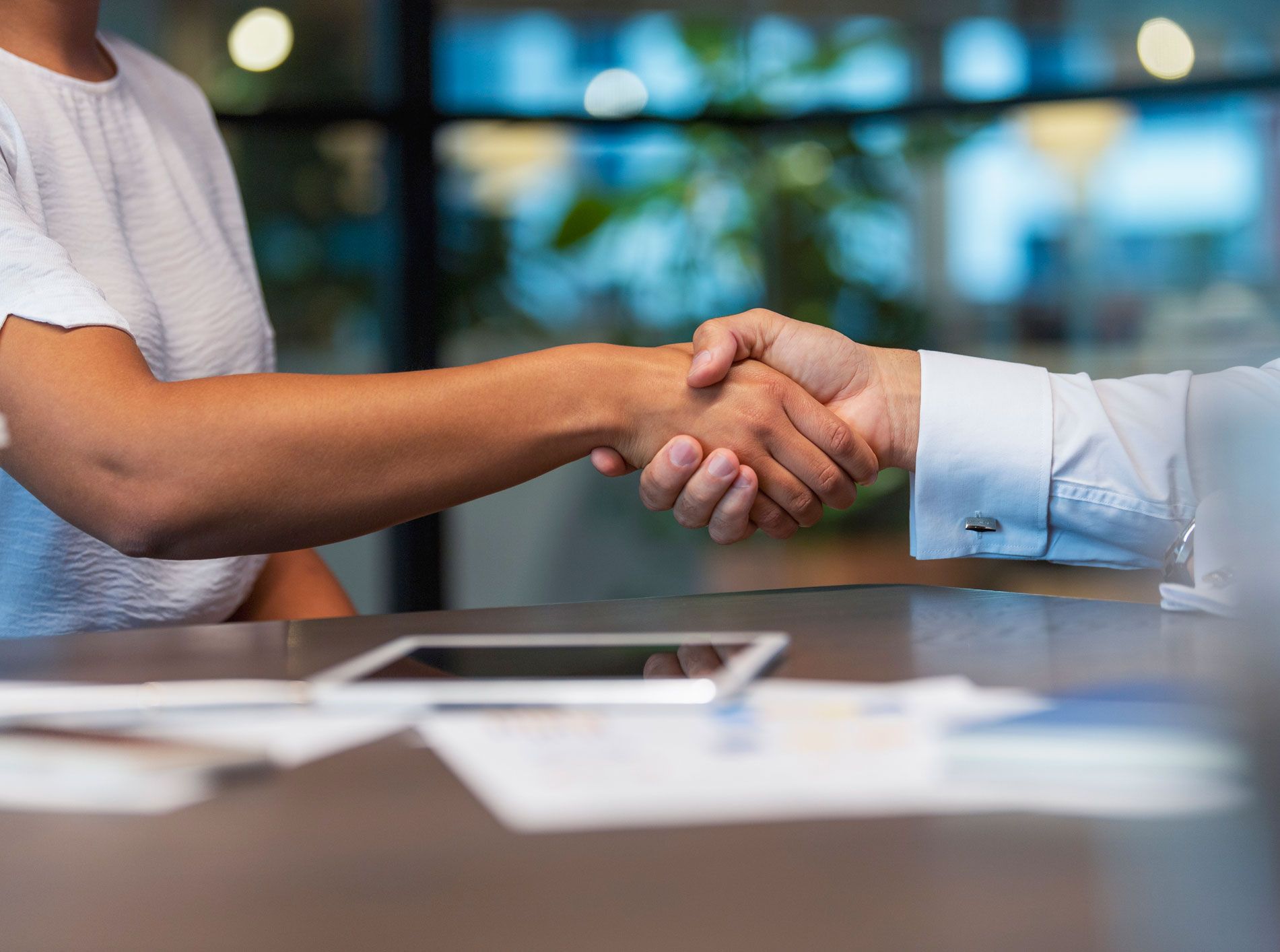 Woman And Man Shaking Hands — Venice, FL — Hough & Co CPA Woman And Man Shaking Hands — Venice, FL — Hough & Co CPA