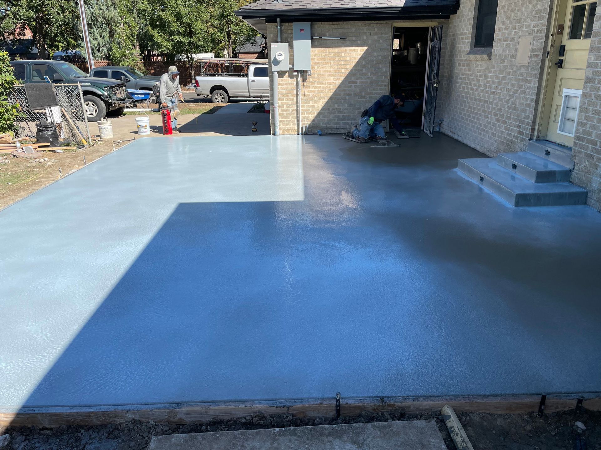 A concrete foundation is being built in a residential area.