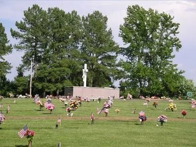 Flower bouquets on gravestones in a cemetery