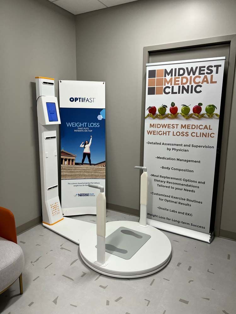 A room with a sign that says `` midwest medical clinic '' and a scale.