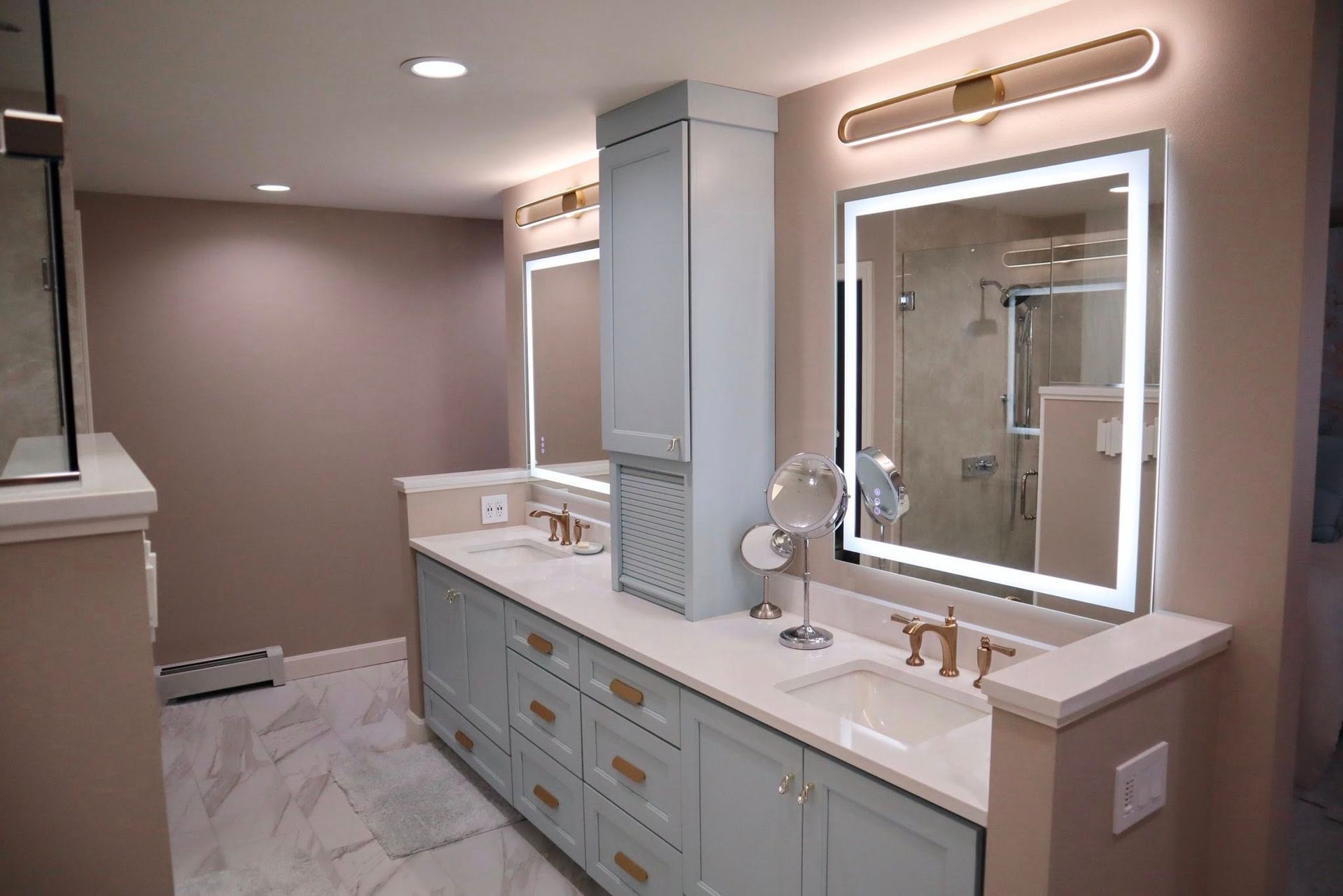 Modern bathroom with freestanding tub, window, vanity, mirror, and neutral decor