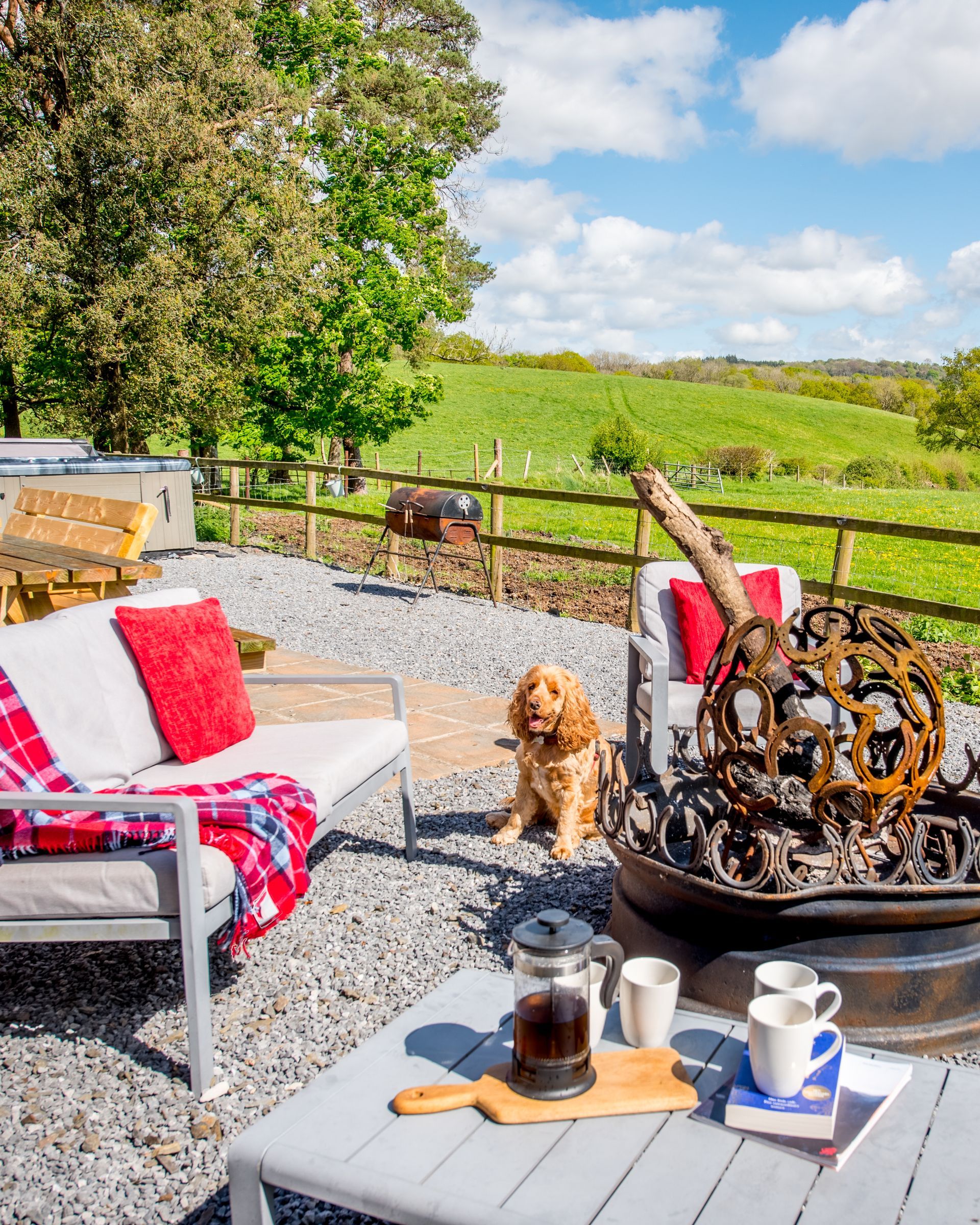 Countryside view from The Farmhouse at Green Grove Barns with open fields and trees.