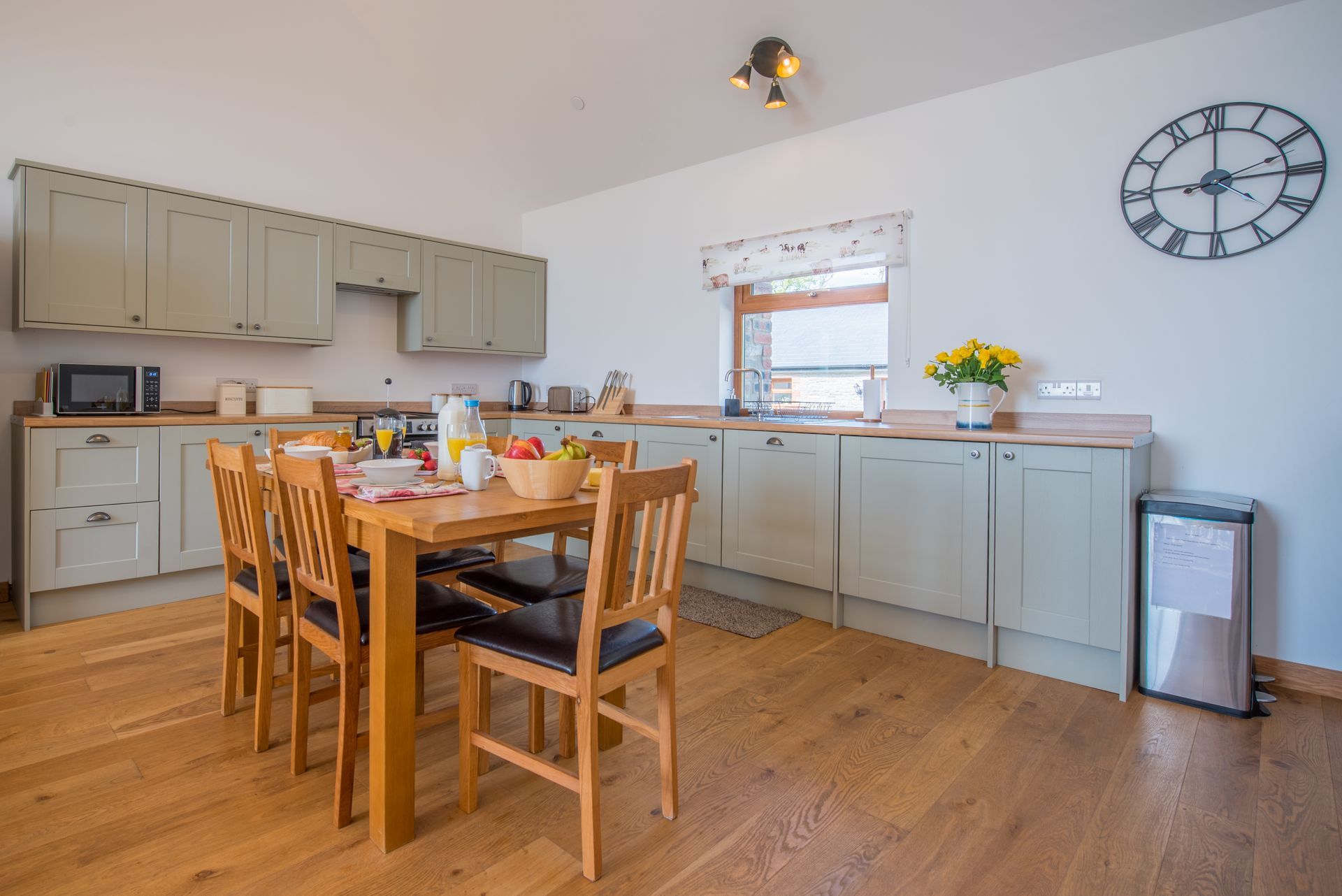 Open-plan kitchen and dining area at The Cowshed, Green Grove Barns.