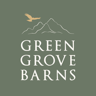 Green Grove Barns logo with mountain outline and flying bird.