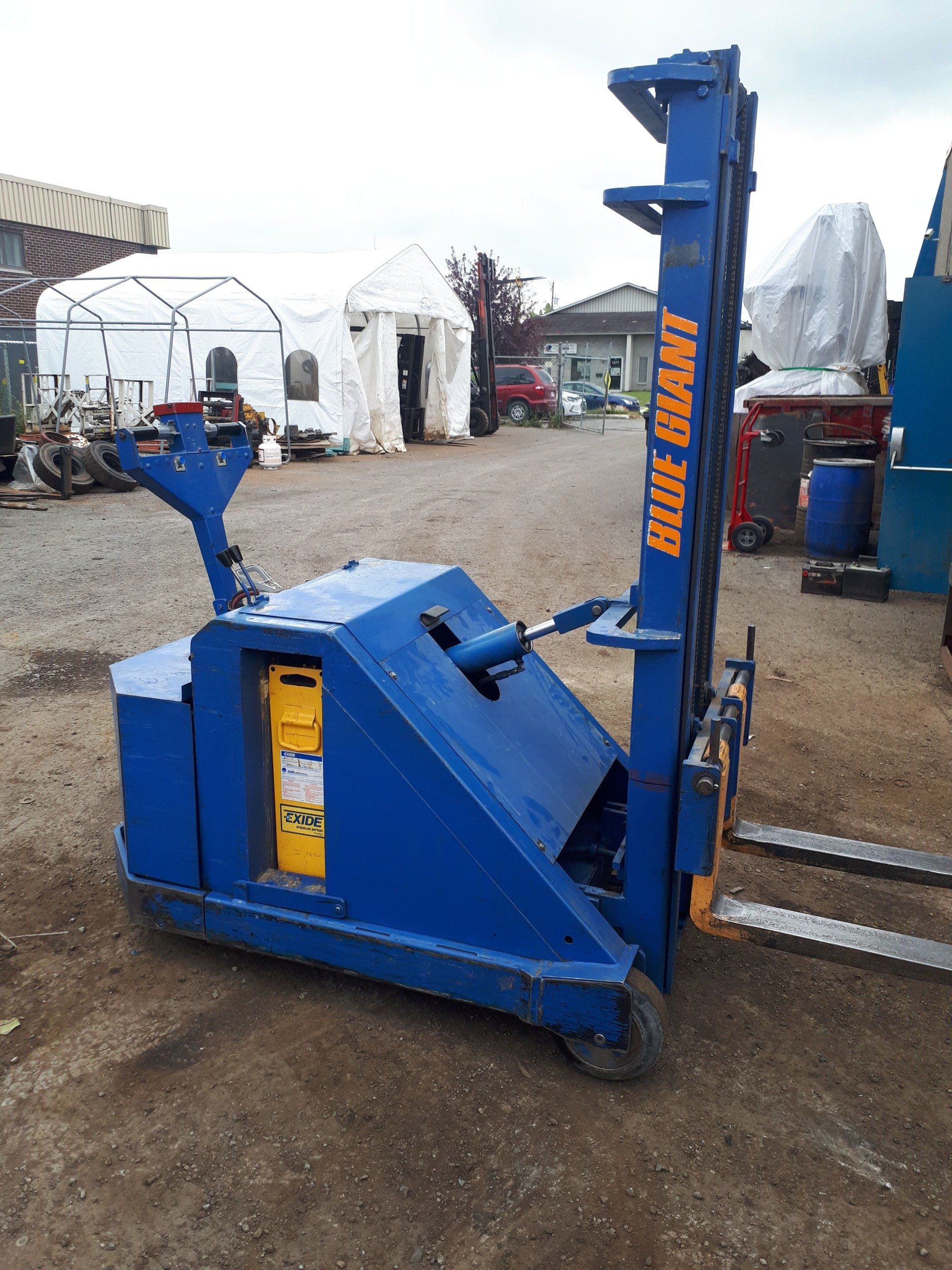 A blue forklift with the word blue bear on it