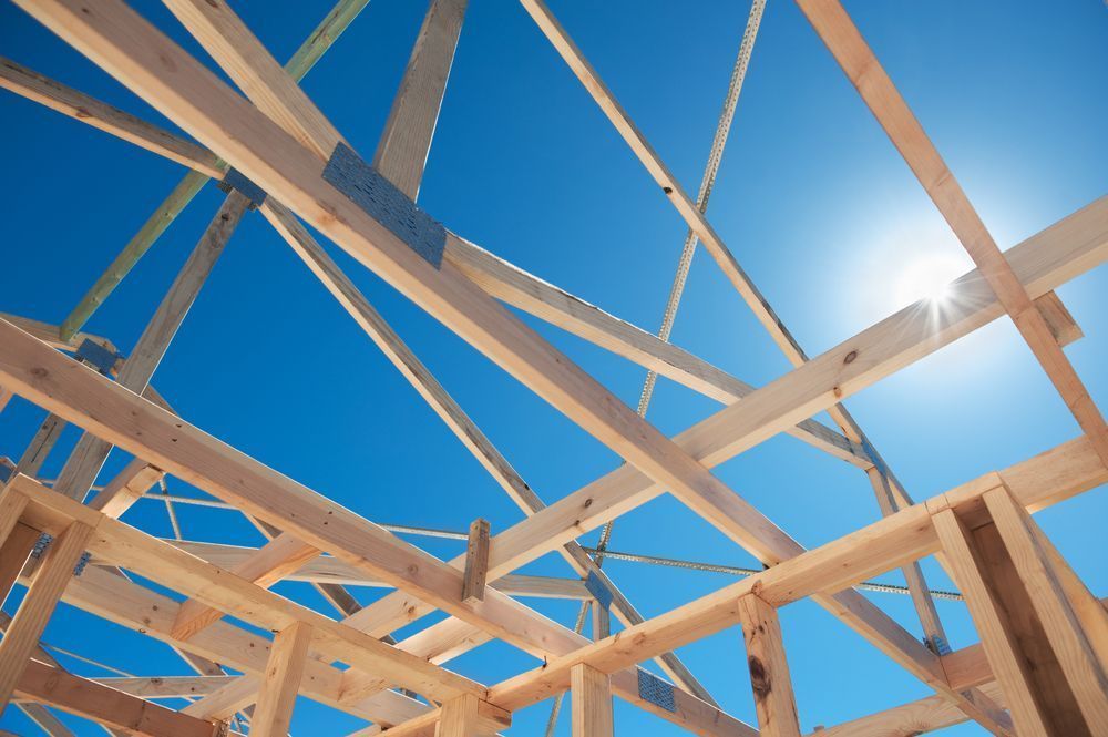 Wooden House Frame Against a Bright Blue Sky — Sly Bros in Woodburn, NSW
