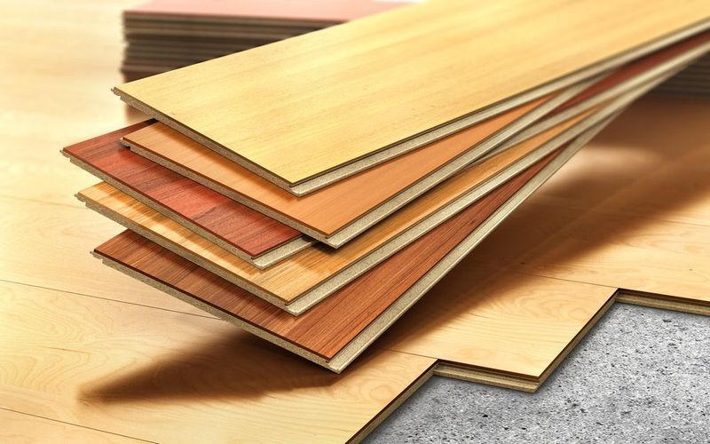 Wood Flooring Samples in Varying Shades Stacked on a Floor — Sly Bros in Woodburn, NSW