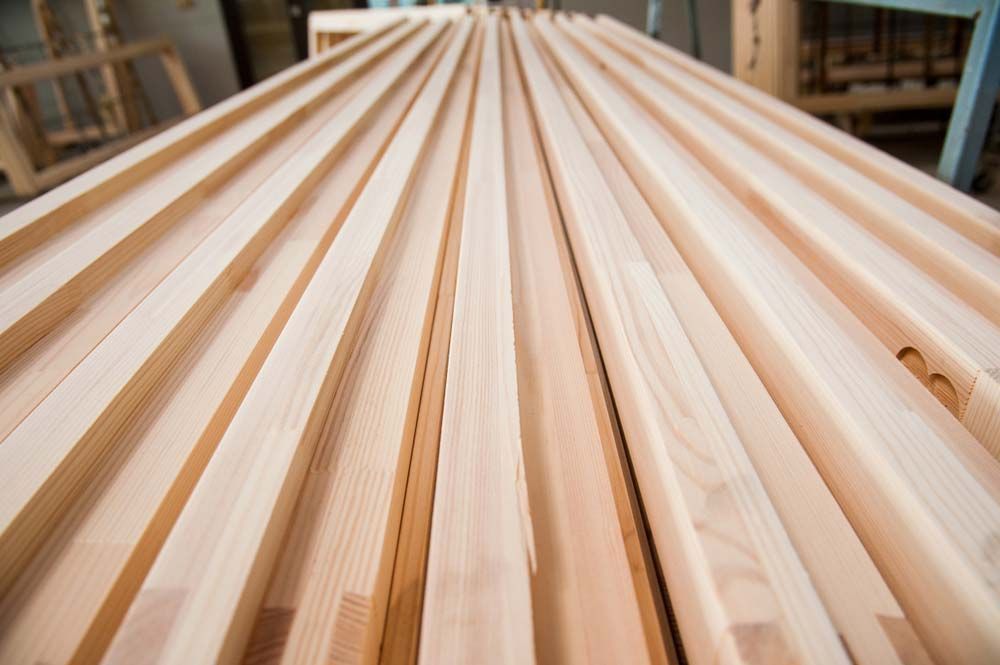Rows of Light-colored Wooden Planks Neatly Arranged — Sly Bros in Woodburn, NSW