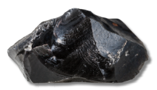 A close up of a black rock on a white background