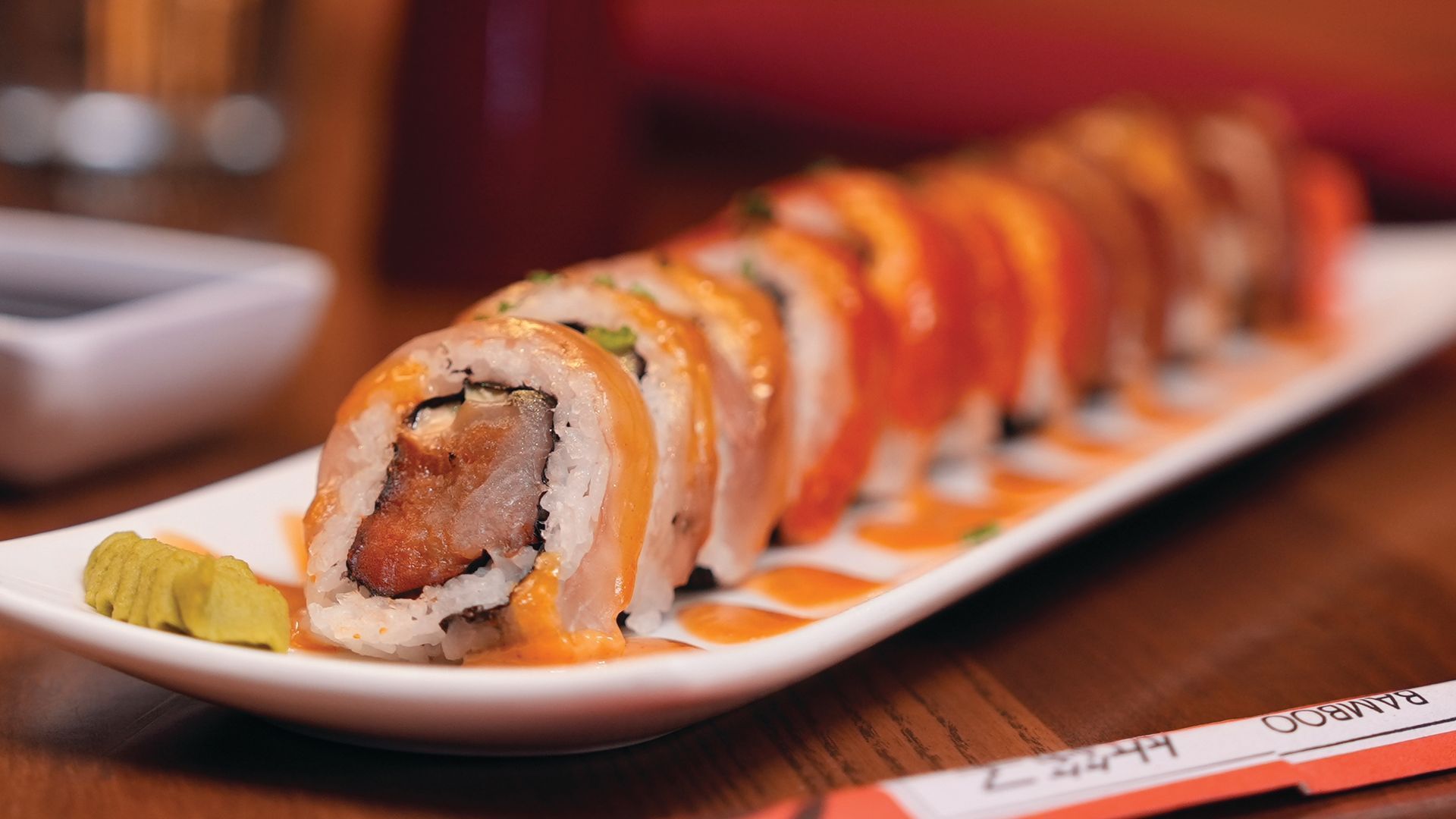 A plate of sushi with chopsticks at GreatHorse