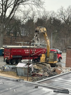 More demolition debrid being loaded into a DVC barrel trailer. 