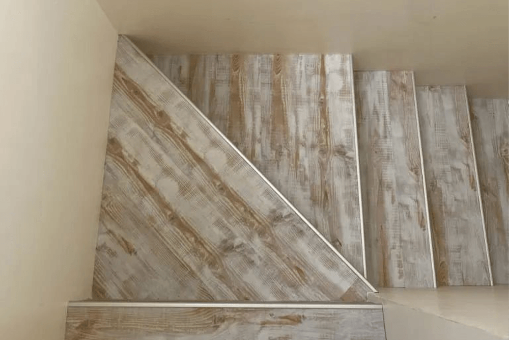 Wooden Laminate Flooring On Stairs — Geoff Thompson's Independent Flooring Centre In Laurieton, NSW