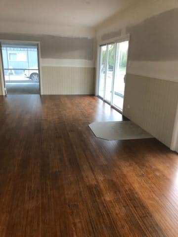 Empty Room With Wooden Vinyl Flooring — Geoff Thompson's Independent Flooring Centre In Port Macquarie, NSW