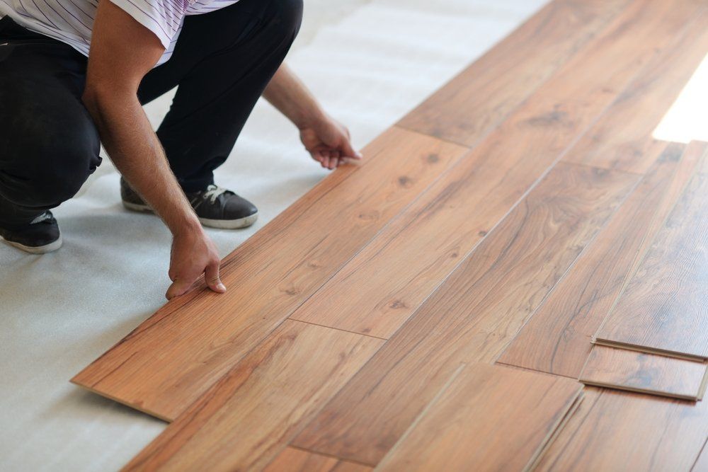 Installing Laminate Flooring In New Home — Geoff Thompson's Independent Flooring Centre In Wauchope, NSW